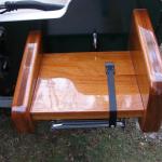 Mahogany boarding transom platform with telescoping stainless steel ladder.